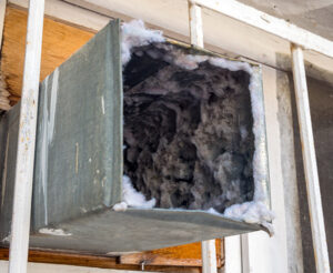 Duct cleaning in Toms River should be done when ducts look like this open ended square duct filled with dust and mold
