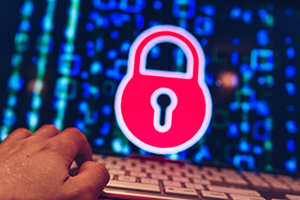 Bright red pad lock on a computer screen to symbolize the security that ATM companies in NJ provide community financial institutions