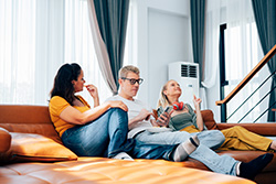 Family enjoying comfortable indoor air temps with Toms River air conditioner repair